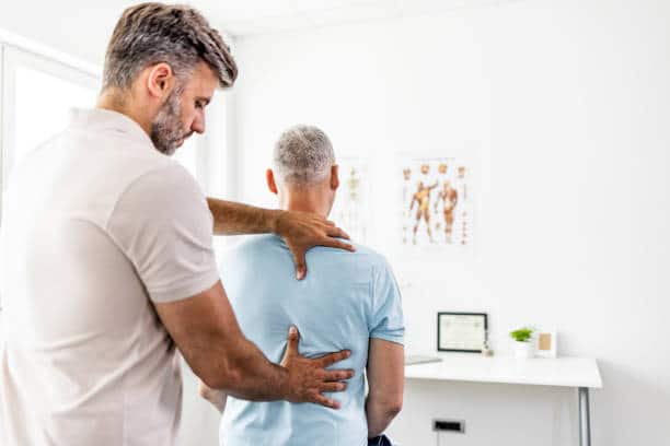 Older Man Receives Chiropractic Treatment